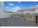Wide shot of a stained gray deck overlooking neighboring townhomes at 964 Catamaran Ct, Alpharetta, GA 30005