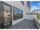 Private deck space with wood flooring and black metal railings, perfect for outdoor relaxation and entertaining at 964 Catamaran Ct, Alpharetta, GA 30005