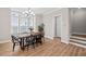 Cozy dining room with a wooden table, chandelier, and ample natural light at 964 Catamaran Ct, Alpharetta, GA 30005