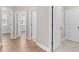 Hallway view showing attractive hardwood floors and multiple doorways to other rooms at 964 Catamaran Ct, Alpharetta, GA 30005