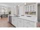 Bright kitchen featuring a large island, stainless steel appliances, and white cabinetry at 964 Catamaran Ct, Alpharetta, GA 30005