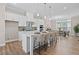 Well-appointed kitchen featuring quartz countertops, a central island, modern appliances, and ample seating at 964 Catamaran Ct, Alpharetta, GA 30005