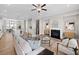Open-concept living space featuring a modern kitchen, dining area, and cozy living room with a fireplace at 964 Catamaran Ct, Alpharetta, GA 30005