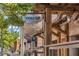 Exterior shot of 'Truck & Tap' with rustic wood accents and outdoor seating, advertising food trucks and craft beer at 964 Catamaran Ct, Alpharetta, GA 30005