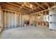 Spacious unfinished basement with open ceiling, framed walls, and concrete flooring at 2005 Haley Walk, Woodstock, GA 30188