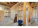 Unfinished basement shows a framed wall, insulation, and concrete flooring at 2005 Haley Walk, Woodstock, GA 30188