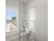 Modern bathroom featuring glass shower, toilet, and window at 2005 Haley Walk, Woodstock, GA 30188