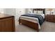 Comfortable bedroom with plush carpeting, wood bed frame, and side tables at 2005 Haley Walk, Woodstock, GA 30188