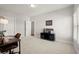 Neutral bedroom with a dark TV stand and a desk at 2005 Haley Walk, Woodstock, GA 30188