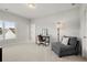 Bright room with a comfortable gray chair and a dark desk at 2005 Haley Walk, Woodstock, GA 30188