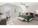 Bedroom with a bench, neutral decor, and two large windows at 2005 Haley Walk, Woodstock, GA 30188