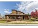 Beautiful community clubhouse with wood accents and inviting covered porch at 2005 Haley Walk, Woodstock, GA 30188