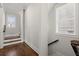 Hallway with hardwood floors and wood stairs at 2005 Haley Walk, Woodstock, GA 30188