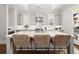 Bright kitchen features a large island with seating, stainless steel appliances, and modern gray cabinetry at 2005 Haley Walk, Woodstock, GA 30188