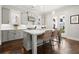 Bright kitchen features a large island with seating and stainless steel appliances, and doors that lead outside at 2005 Haley Walk, Woodstock, GA 30188
