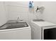 Functional laundry room with modern washer and dryer at 2005 Haley Walk, Woodstock, GA 30188