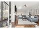 Spacious living room with hardwood floors, a cozy fireplace, and stylish modern furnishings at 2005 Haley Walk, Woodstock, GA 30188