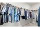 Walk-in closet with clothes hanging from rods at 2005 Haley Walk, Woodstock, GA 30188