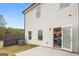 Cozy patio and backyard with a view into the kitchen, which has blue chairs at 216 Eping Dr, Stockbridge, GA 30281