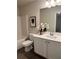 Well-lit bathroom features modern vanity, framed mirror, and white cabinetry at 216 Eping Dr, Stockbridge, GA 30281