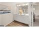 Bathroom with double sink vanity, white cabinets and view into a bedroom at 216 Eping Dr, Stockbridge, GA 30281