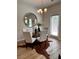 Bright dining area with modern lighting, a round mirror, and a unique cowhide rug at 216 Eping Dr, Stockbridge, GA 30281