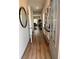 Inviting hallway with wood-look floors and designer accents at 216 Eping Dr, Stockbridge, GA 30281