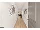 Hallway featuring light-colored wood flooring and decoratively adorned walls at 216 Eping Dr, Stockbridge, GA 30281