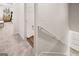 Hallway with neutral carpet leads to bedrooms and closet with wire rack shelving at 216 Eping Dr, Stockbridge, GA 30281