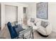 Bright home office featuring a glass desk, comfortable seating, and soft carpeting at 216 Eping Dr, Stockbridge, GA 30281