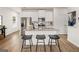 Bright kitchen featuring a large island with bar stool seating and stainless steel appliances at 216 Eping Dr, Stockbridge, GA 30281