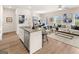 Open-concept kitchen and living area with stainless steel appliances and stylish decor at 216 Eping Dr, Stockbridge, GA 30281