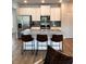 The kitchen features an island with bar stool seating and stainless steel appliances at 216 Eping Dr, Stockbridge, GA 30281