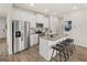 Modern kitchen with stainless steel appliances and island with breakfast bar seating at 216 Eping Dr, Stockbridge, GA 30281