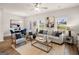 Bright and airy living room featuring modern decor, ceiling fan, and neutral color palette at 216 Eping Dr, Stockbridge, GA 30281
