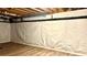 Finished basement with vapor barrier, wood-look flooring, and ceiling insulation at 313 Summit Ridge Dr, Lawrenceville, GA 30046