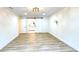 Bright bedroom with wood-look flooring, modern lighting, and a stylish barn door at 313 Summit Ridge Dr, Lawrenceville, GA 30046