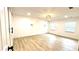 Spacious bedroom with luxury vinyl plank flooring, recessed lights, and contemporary wall sconces at 313 Summit Ridge Dr, Lawrenceville, GA 30046