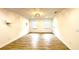 Empty bedroom with wood-look floors, recessed lights, and light-colored walls at 313 Summit Ridge Dr, Lawrenceville, GA 30046