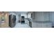 Bright kitchen featuring white cabinets, subway tile backsplash, and stainless steel appliances at 313 Summit Ridge Dr, Lawrenceville, GA 30046