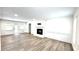 Spacious living room with hardwood floors, fireplace, and abundant natural light at 313 Summit Ridge Dr, Lawrenceville, GA 30046