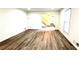 Bright living room with hardwood floors leading to a staircase at 313 Summit Ridge Dr, Lawrenceville, GA 30046