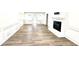 Cozy living room featuring hardwood floors, fireplace, and views to the backyard at 313 Summit Ridge Dr, Lawrenceville, GA 30046