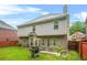 Spacious, grassy backyard with a patio, grill and outdoor seating, great for entertaining at 3492 Newtons Crest Cir, Snellville, GA 30078