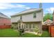 Spacious, grassy backyard with a patio, grill and outdoor seating, great for entertaining at 3492 Newtons Crest Cir, Snellville, GA 30078