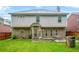 Inviting backyard with green lawn, brick accents, patio and barbeque area, perfect for gatherings at 3492 Newtons Crest Cir, Snellville, GA 30078