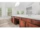 Spacious bathroom featuring double sink vanity, large windows, and a soaking tub at 3492 Newtons Crest Cir, Snellville, GA 30078
