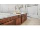 Bathroom featuring double sink vanity with neutral countertops, tile floors and bath tub and shower combo at 3492 Newtons Crest Cir, Snellville, GA 30078