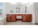 Spacious bathroom with double sinks, large mirror, bath tub and tile floor at 3492 Newtons Crest Cir, Snellville, GA 30078