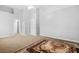 Large bedroom with neutral walls, carpet, and a small horizontal window and a white ceiling fan at 3492 Newtons Crest Cir, Snellville, GA 30078